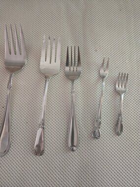 5 assorted styles , size, & patterns of fork, visible wear , sold "as is"